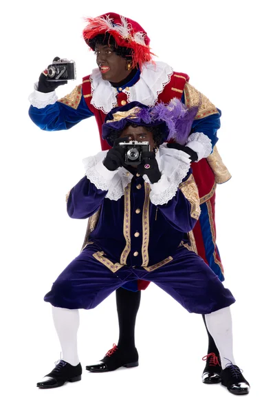 Zwarte piet y su compañero de trabajo están tomando fotografías — Stockfoto