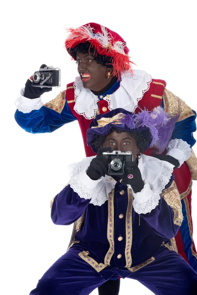 Zwarte Piet and his co-worker are taking photographs — Stock Photo, Image