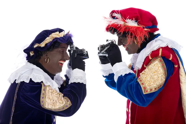 Zwarte piet y su compañero de trabajo están tomando fotografías — Stockfoto