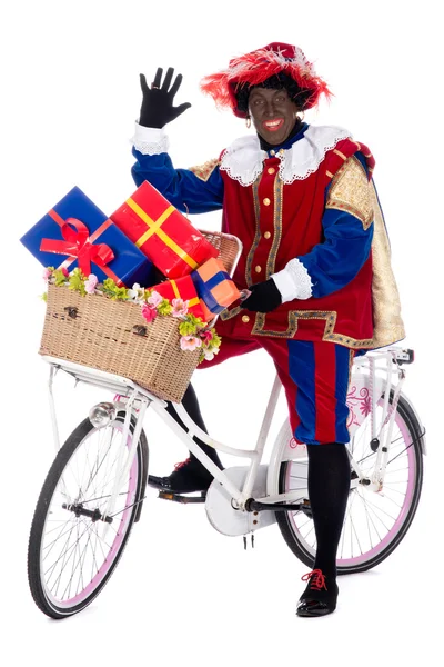 Zwarte Piet naik sepeda dengan hadiah — Stok Foto