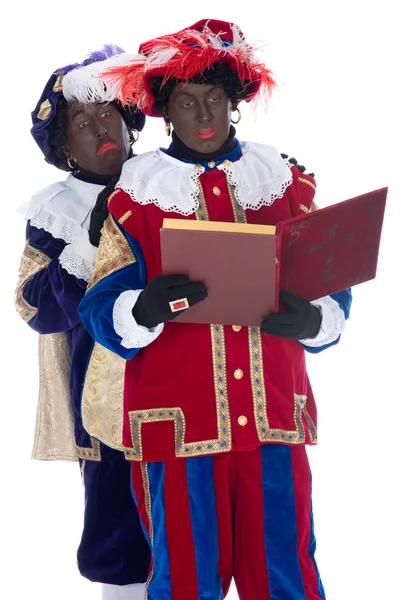 Zwarte Piet and the book of Sinterklaas — Stock Photo, Image