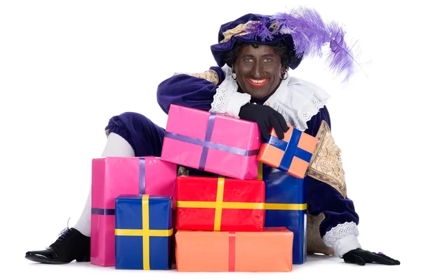 Zwarte Piet mit vielen Geschenken — Stockfoto