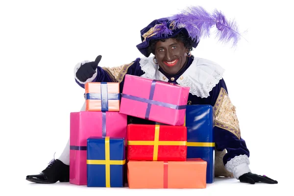 Zwarte piet med en massa presenter — Stockfoto