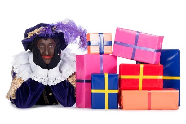 Zwarte Piet mit vielen Geschenken — Stockfoto