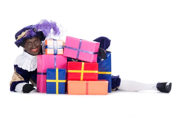 Zwarte Piet com um monte de presentes — Fotografia de Stock