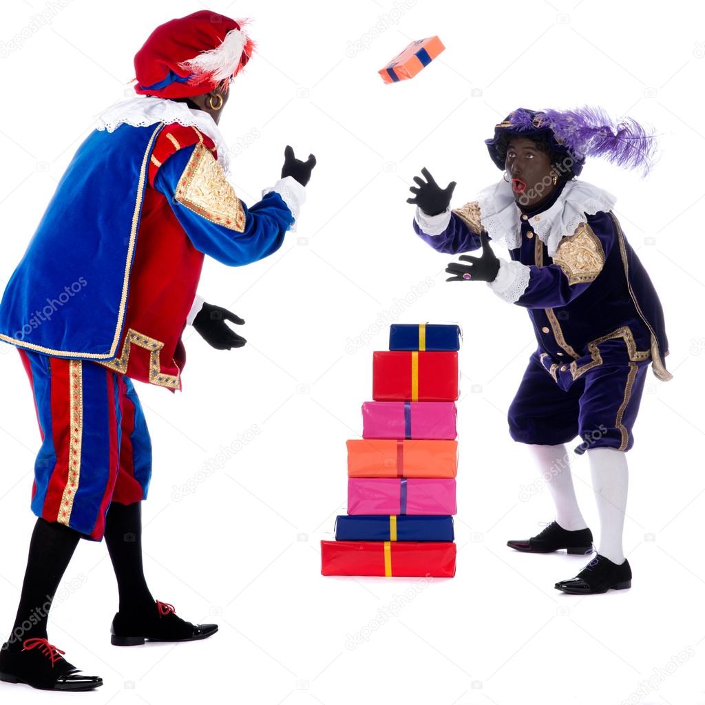 Zwarte Piet is throwing with the presents