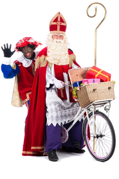 Sinterklaas i czarny pete na rowerze — Zdjęcie stockowe