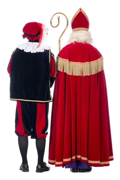Sinterklaas och svart pete från baksidan — Stockfoto