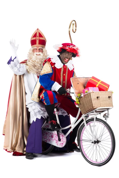 Sinterklaas i czarny pete na rowerze — Zdjęcie stockowe