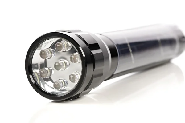 Closeup of a black LED flashlight Royalty Free Stock Images