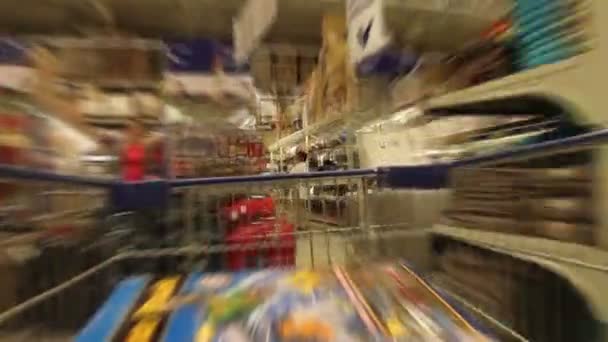 Trolley in a supermarket — Stock Video