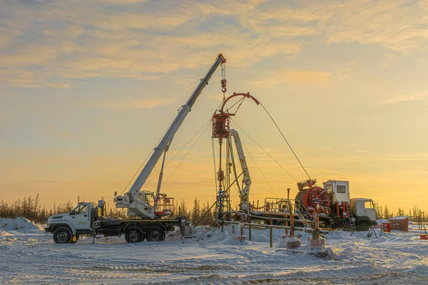 stock image Equipment with a flexible pipe for descent to a well when it is mastered on the northern gas field. Application of flexible tube in wells