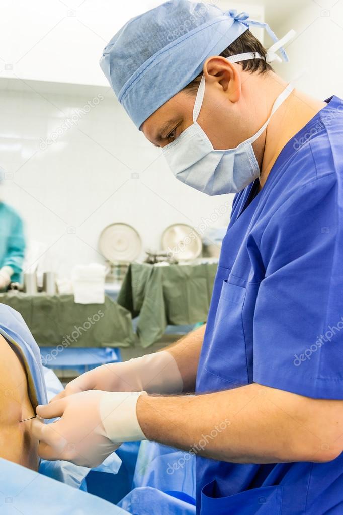 Doctor performing epidural anesthesia — Stock Photo © beerkoff1 32713915
