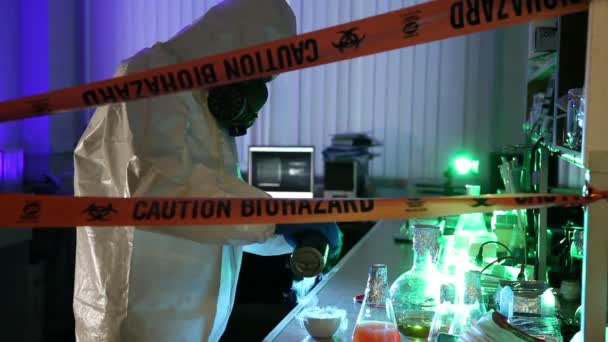 Scientist behind the caution tape laboratory with equipment — Stock Video