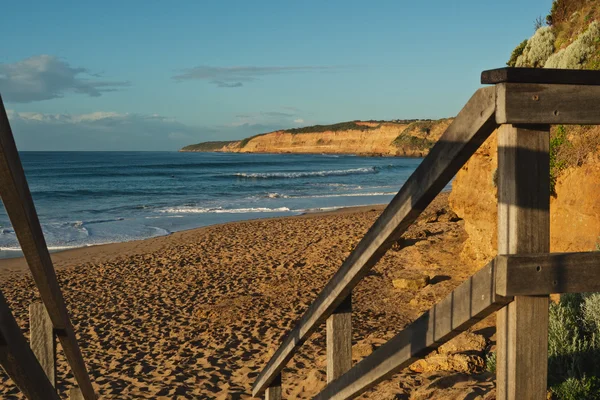 Wooden rail at beach — Stock Photo, Image