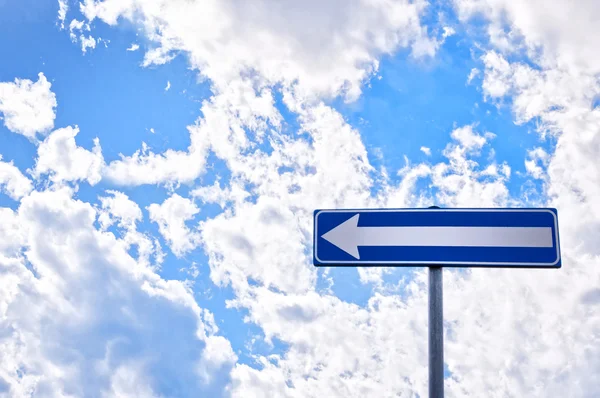 Direction road sign with cloudy sky — Stock Photo, Image