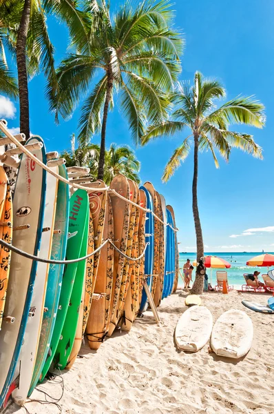 Surfboards lined up in the rack at famous Waikiki Beach Stock Photo