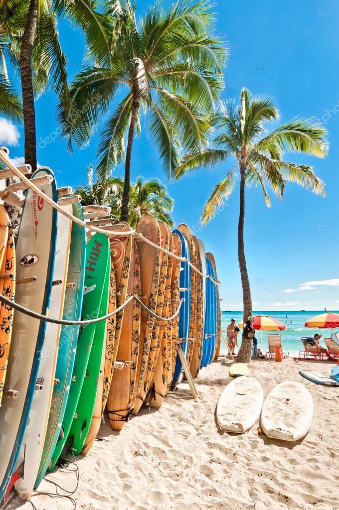 Surfboards lined up in the rack at famous Waikiki Beach Stock