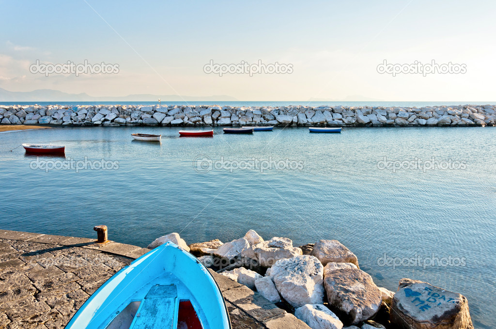 Mediterranean sea and boat in Naples bay