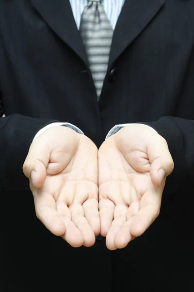 Biznesmen dając ręce — Zdjęcie stockowe