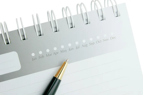 Ручка на дневнике с полосатой бумагой — стоковое фото