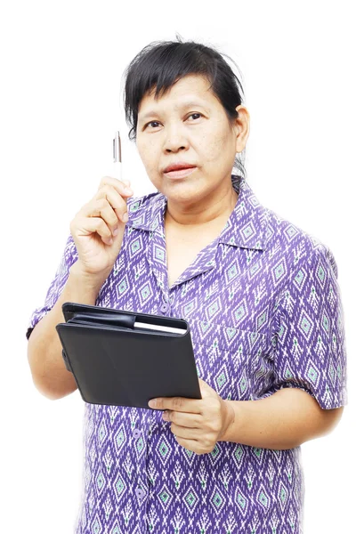 Senior vrouw met een pen — Stockfoto