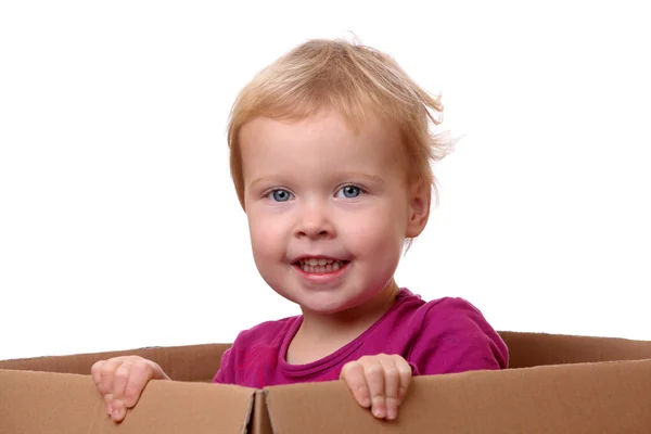 Criança na caixa — Fotografia de Stock
