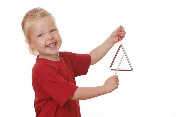 Girl plays triangle — Stock Photo, Image