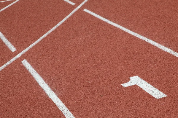 Perspectiva de número um na pista de corrida — Fotografia de Stock