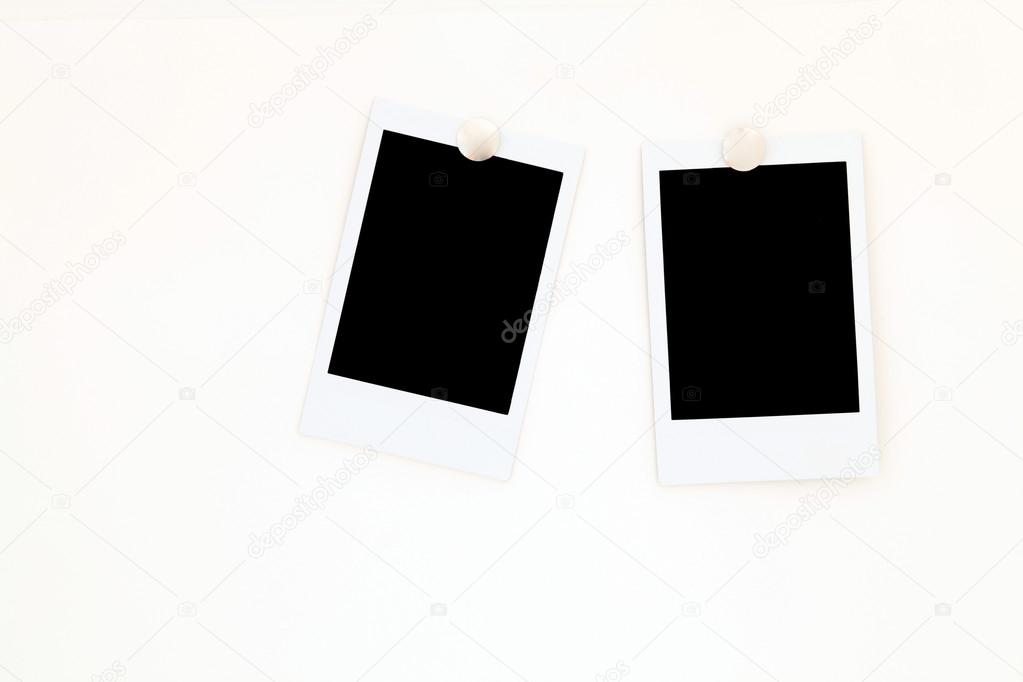 isolated two blank polaroids frames
