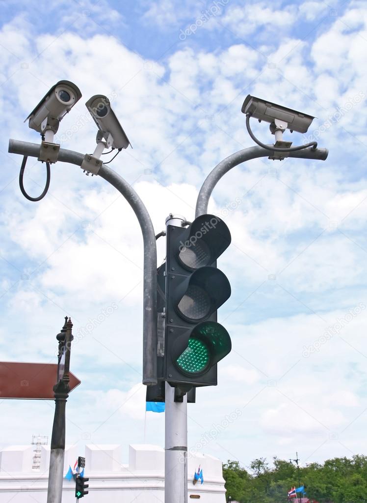 Surveillance Security Camera or CCTV with traffic light — Stock Photo