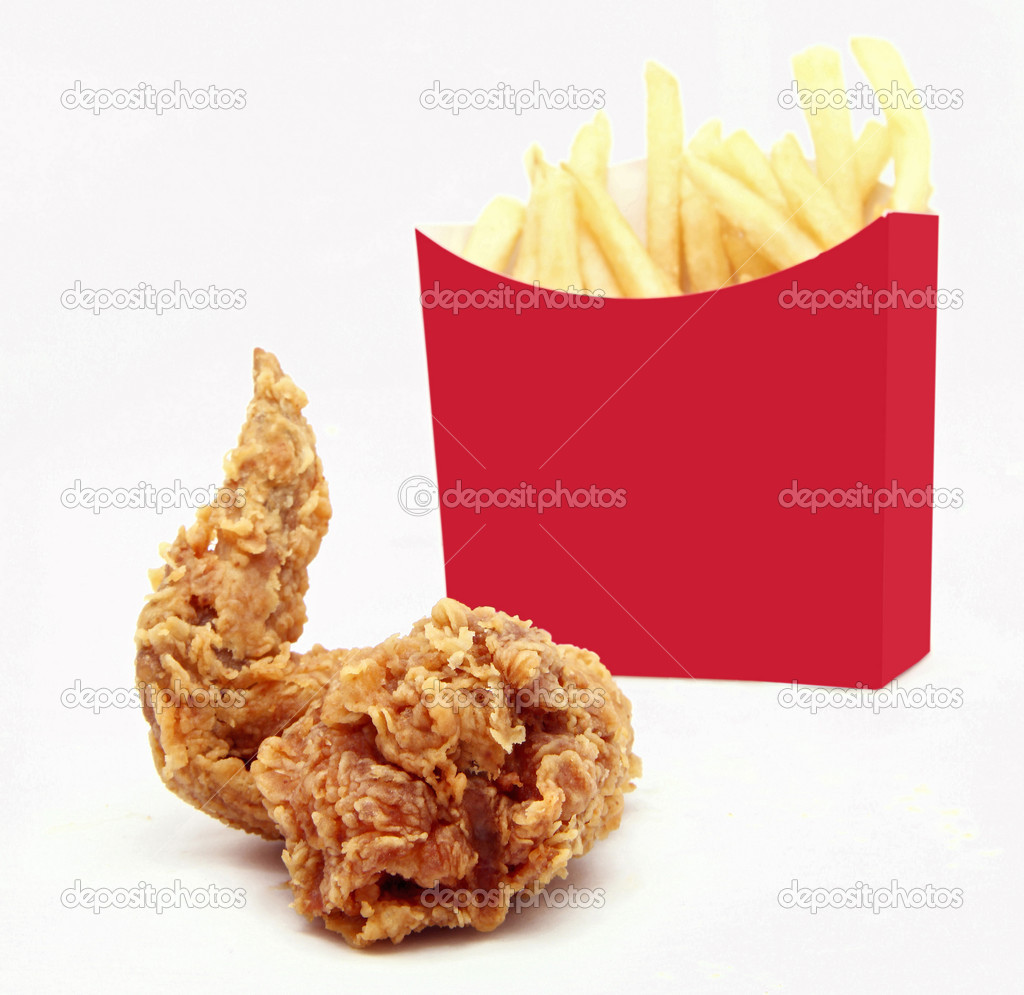 isolated golden brown crispy fried chicken wing with french frie