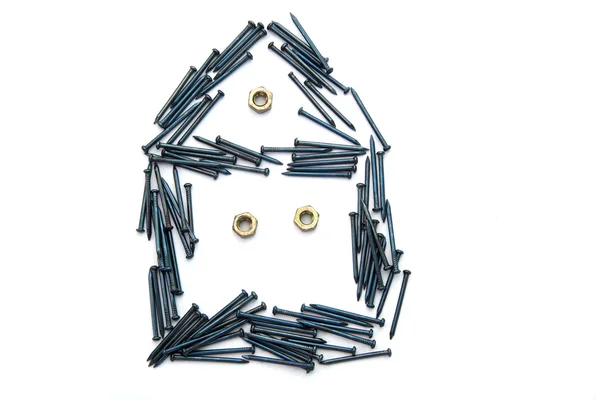 House from nails and bolts — Stock Photo, Image