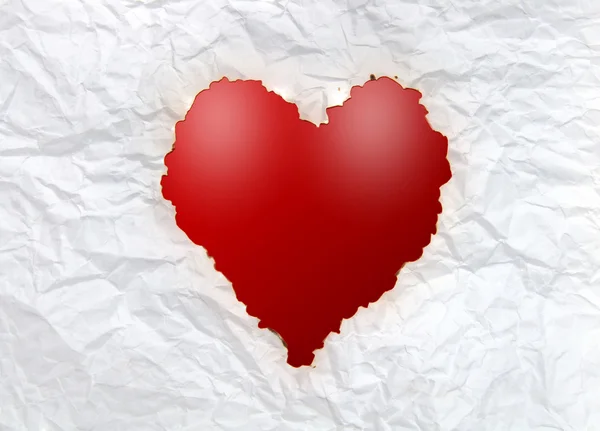Винтажная обожженная бумага в форме сердца — стоковое фото