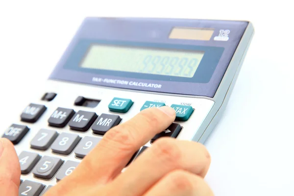 Menselijke vinger op fiscale knop van Rekenmachine — Stockfoto