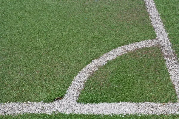 Canto do campo de futebol com grama falsa — Fotografia de Stock