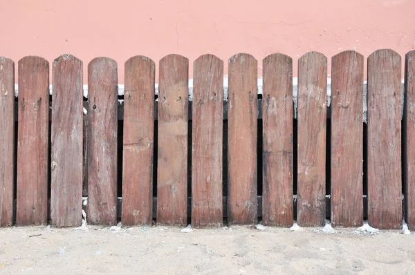 Wooden fence on old rose wall — Zdjęcie stockowe