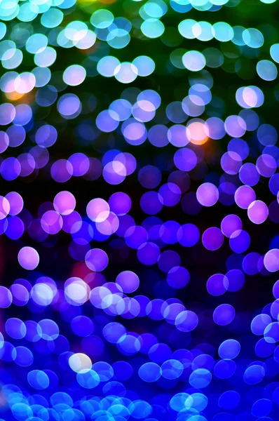 Color Bokeh against a dark background — Stock Photo, Image