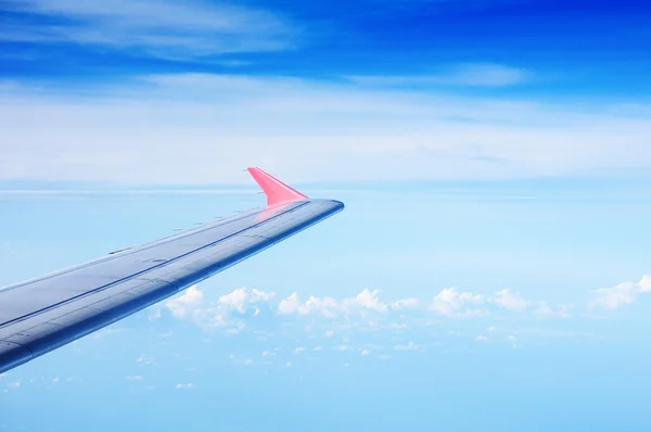 Wing of the plane on sky background — Stock Photo, Image