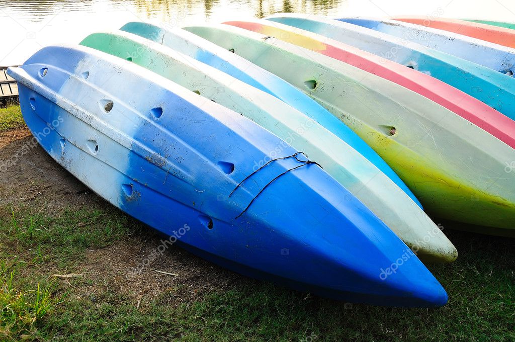 Colorful kayaks in stack