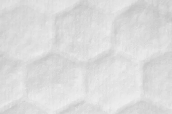 これは、ハニカムや細胞の質感を持つ空白の白い生地の背景です。綿パッドの表面を閉じる. — ストック写真