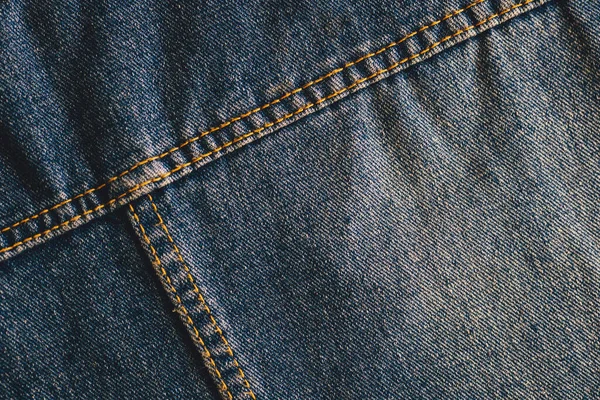 Fashionable denim with stitching. Textile material. Empty surface with space to copy. Part of clothes. — Stock Photo, Image