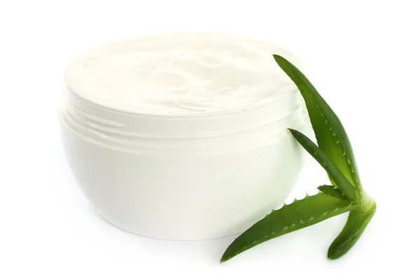 Open plastic container with cream and aloe — Stock Photo, Image