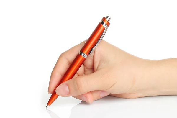 Hand met oranje pen Rechtenvrije Stockfoto's