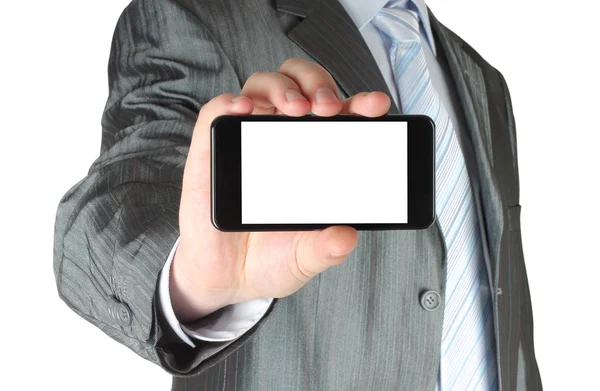 Empresario sosteniendo teléfono inteligente en blanco —  Fotos de Stock