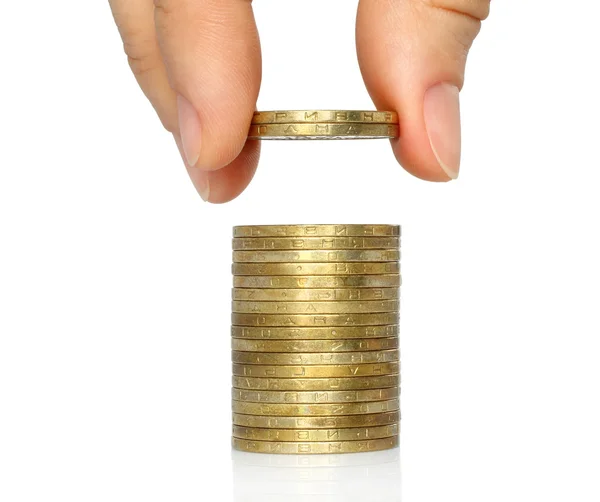 Hand put coins to stack of coins — Stock Photo, Image