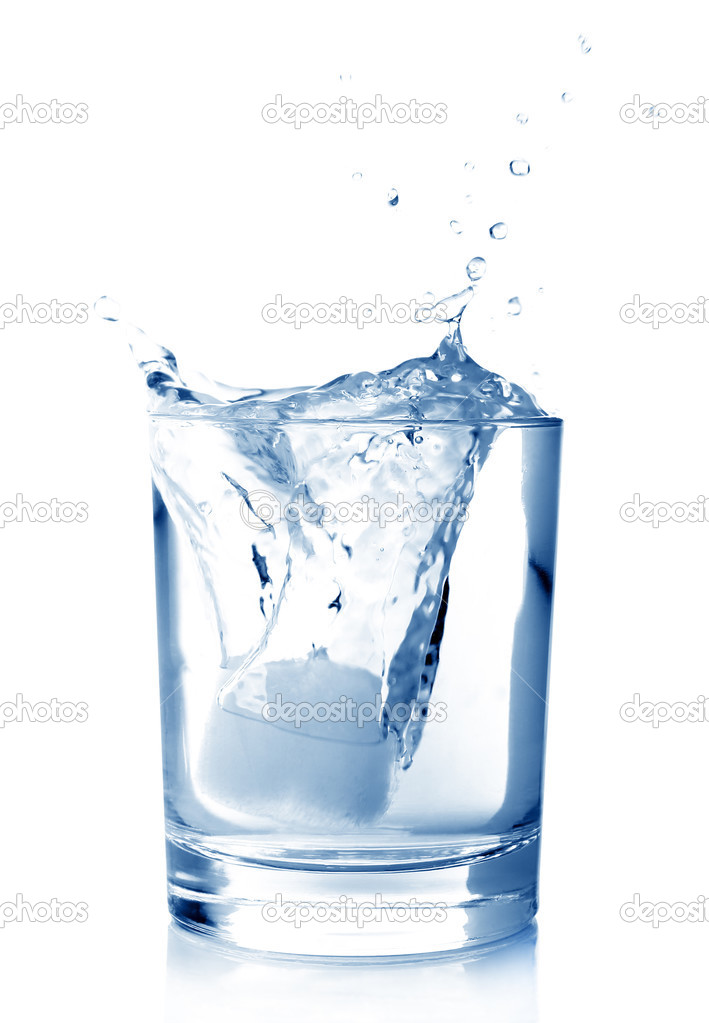 Ice in glass of water with splash