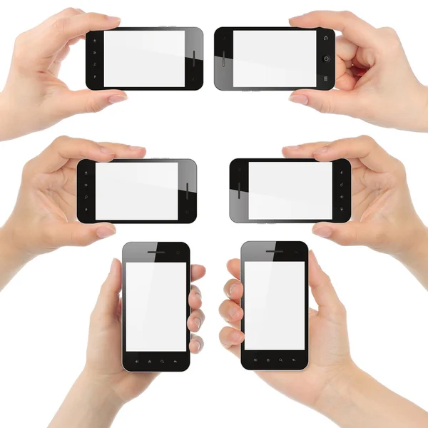 Mãos segurando telefones inteligentes — Fotografia de Stock