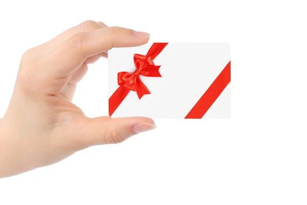 Hand with white card and red bow — Stock Photo, Image
