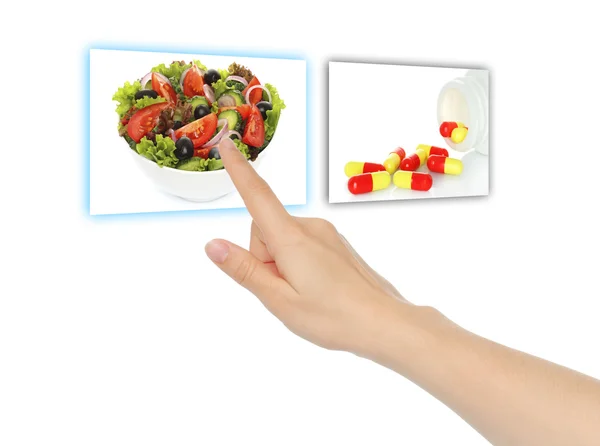 Hand pushing virtual salad instead of pills — Stock Photo, Image